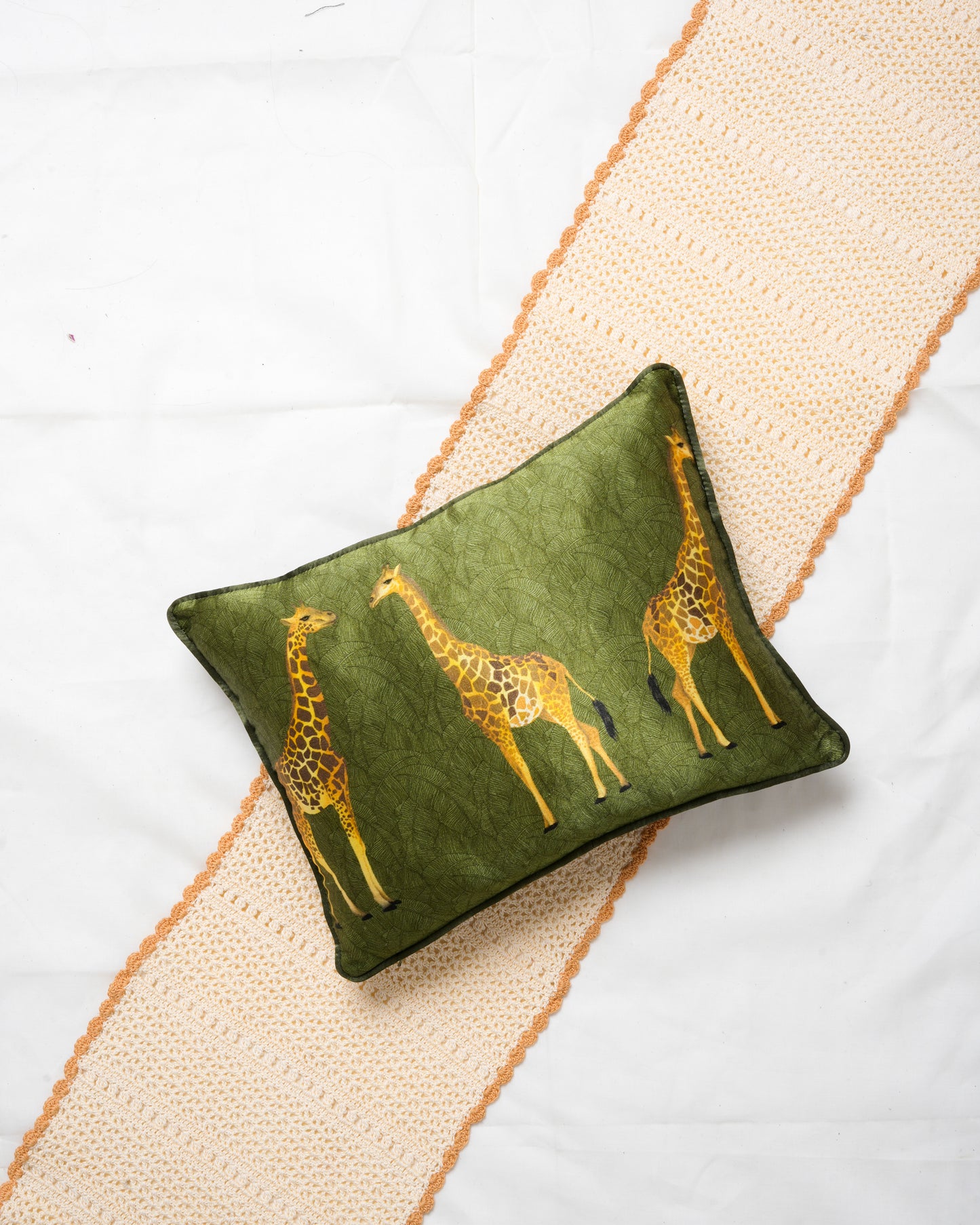Girrafe cushion cover with leaf patterned background